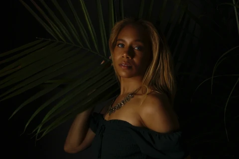 Daisi Jo — jewelry portrait in a black off-the-shoulder top