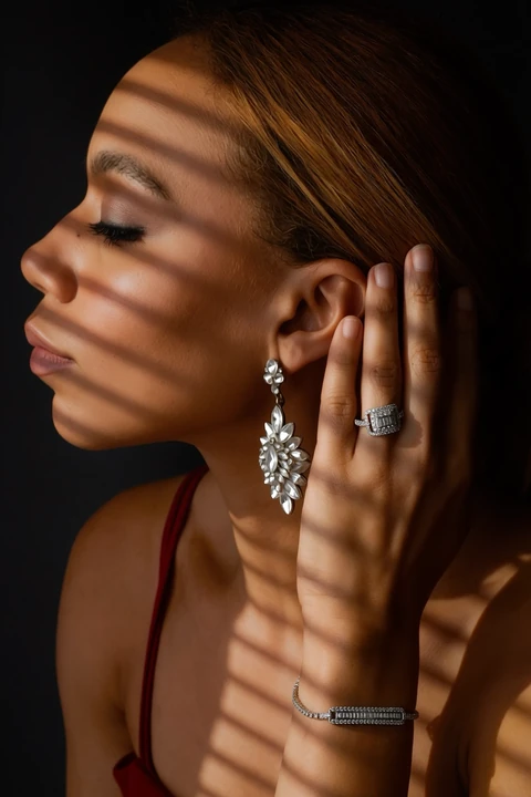 Daisi Jo — jewelry close-up with patterned light and shadow