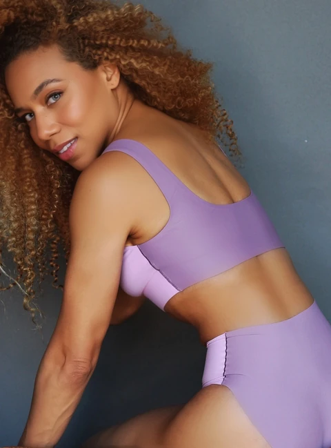 Daisi Jo modeling a lavender Parade underwear set, back view